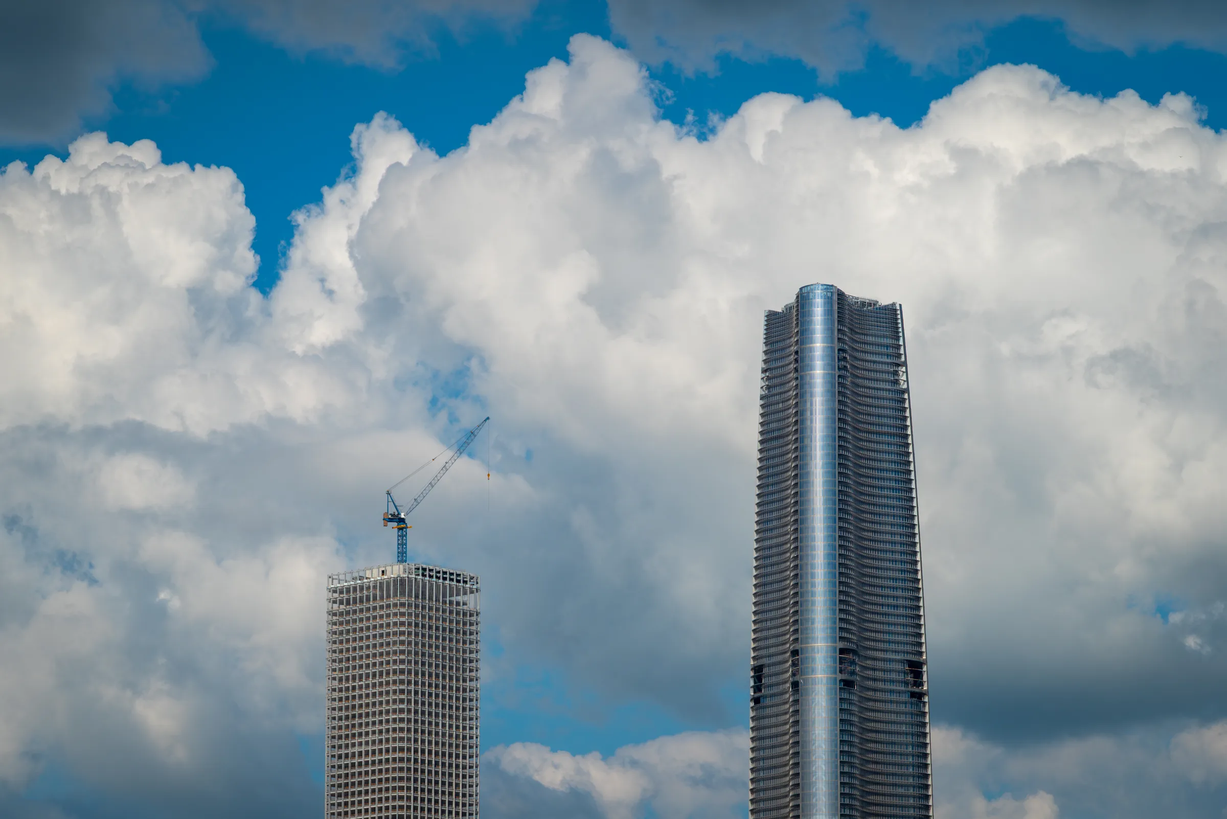 The Wuchang skyline across the river under summer clouds